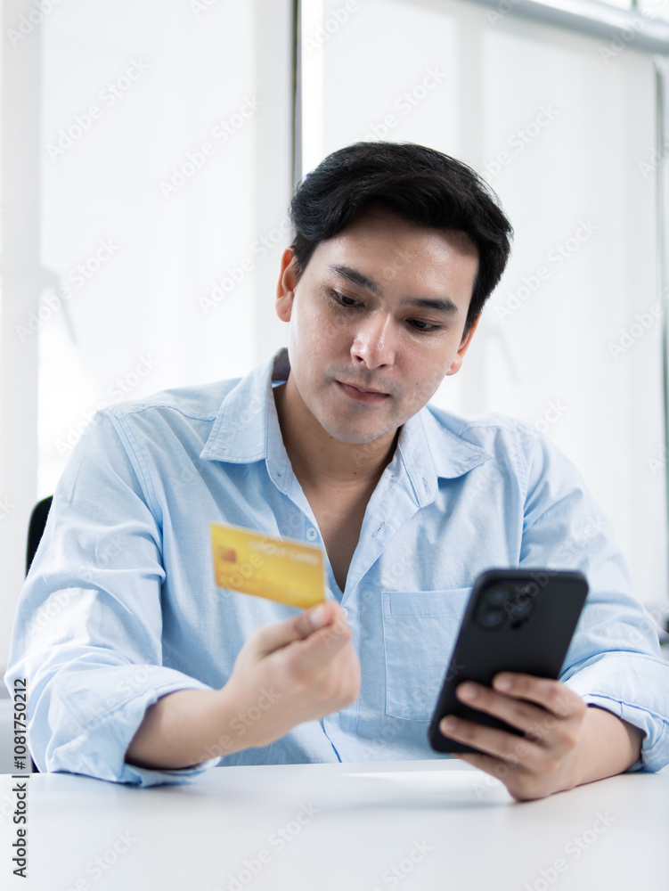 Online shopping action man using smartphone and credit card modern office digital interaction professional environment close-up view e-commerce concept Online shopping action man using smartphone and credit card modern office digital interaction professional environment close-up view e-commerce concept