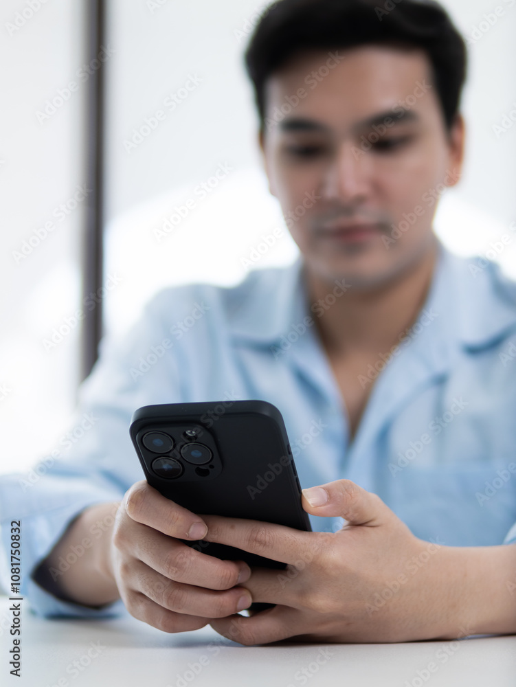 Checking notifications on smartphone indoor office technology lifestyle minimalist environment close-up view digital communication concept