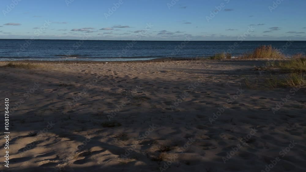 Sunny, windy weather by the sea. Sea beach in autumn. Sunny, windy weather by the sea. Sea beach in autumn.