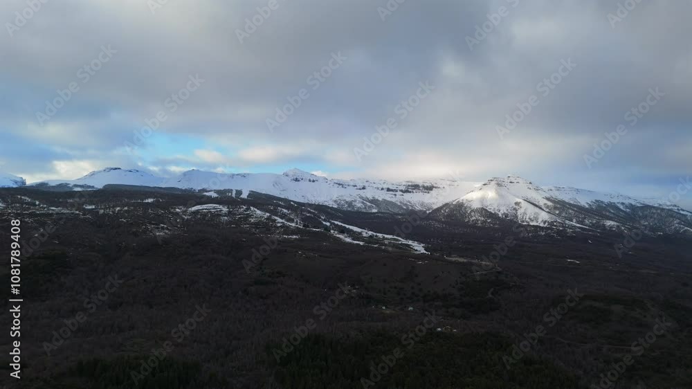 Aerial view of snow-covered mountain range with ski sports center. Neuquén, Argentina. Aerial view of snow-covered mountain range with ski sports center. Neuquén, Argentina.