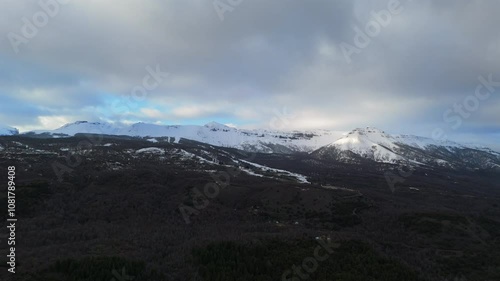 Aerial view of snow-covered mountain range with ski sports center. Neuquén, Argentina. photo