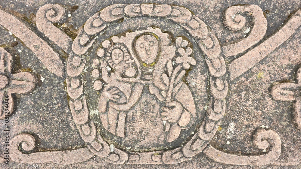 Colonial era stone carving of the Virgin Mary and the Jesus Christ child in a traditional Spanish style Colonial era stone carving of the Virgin Mary and the Jesus Christ child in a traditional Spanish style