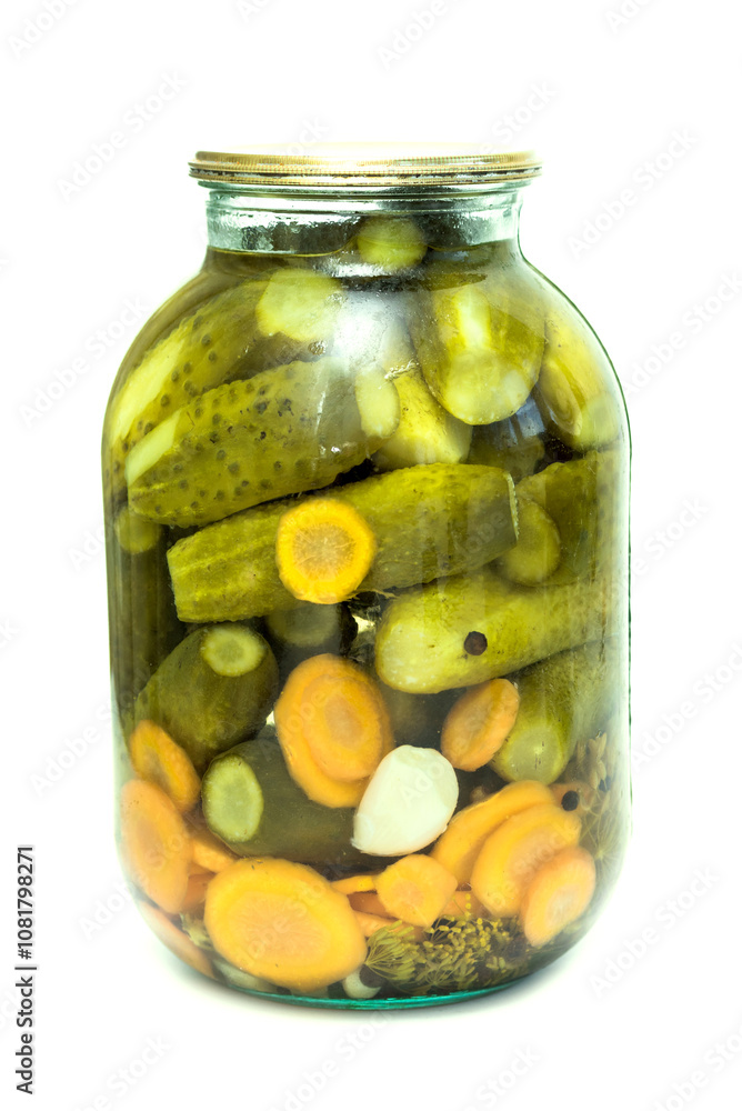 pickles in a glass jar cucumber is isolated on a white background pickles in a glass jar cucumber is isolated on a white background