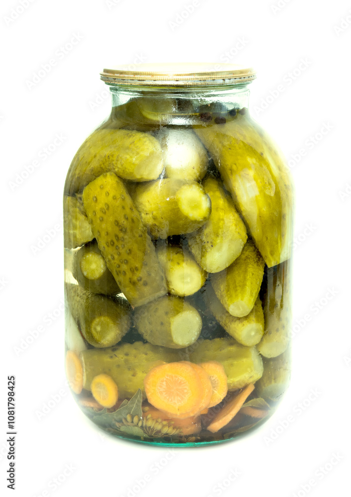 pickles in a glass jar cucumber is isolated on a white background pickles in a glass jar cucumber is isolated on a white background