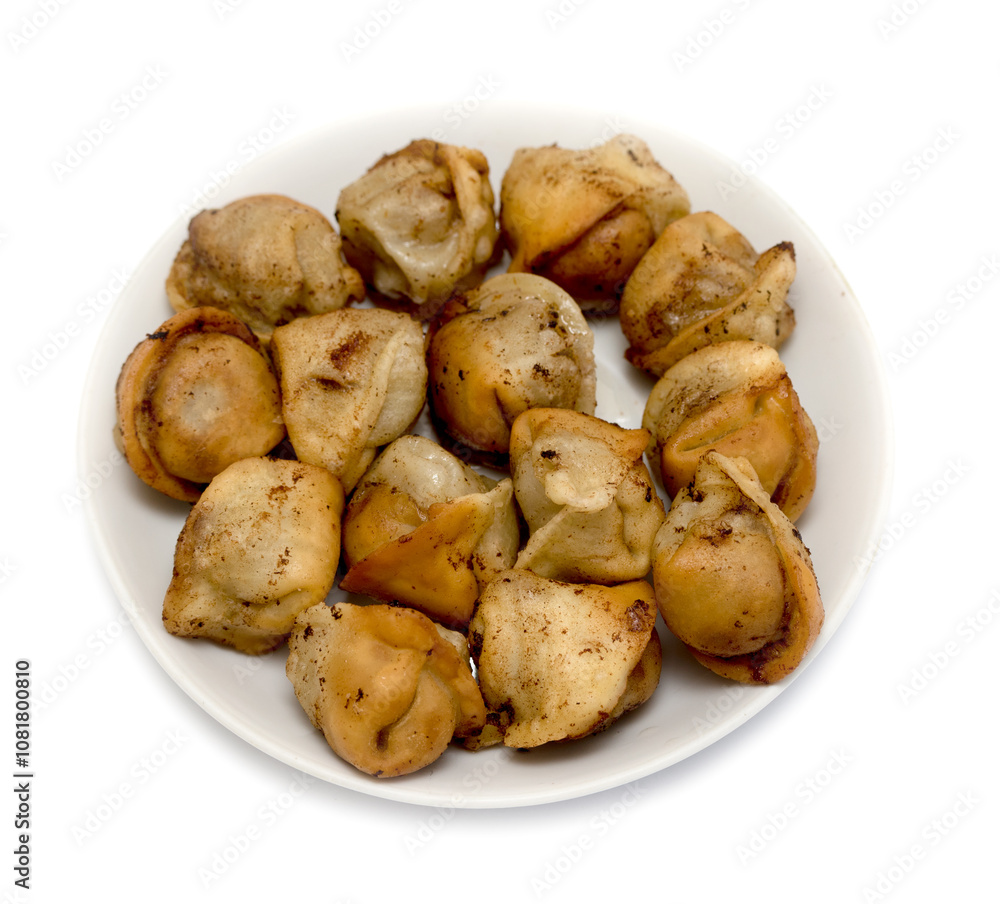 fried dumplings in a plate on a white background fried dumplings in a plate on a white background