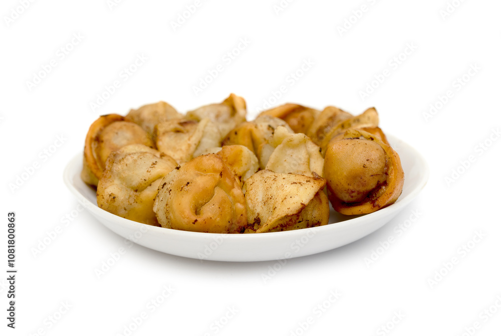 fried dumplings in a plate on a white background fried dumplings in a plate on a white background