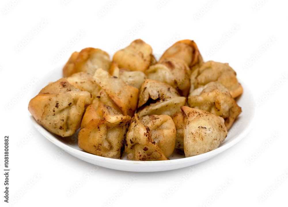 fried dumplings in a plate on a white background fried dumplings in a plate on a white background