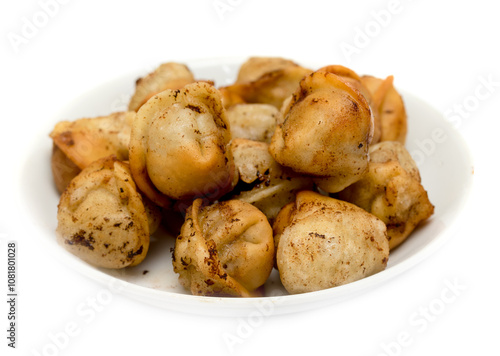 fried dumplings in a plate on a white background