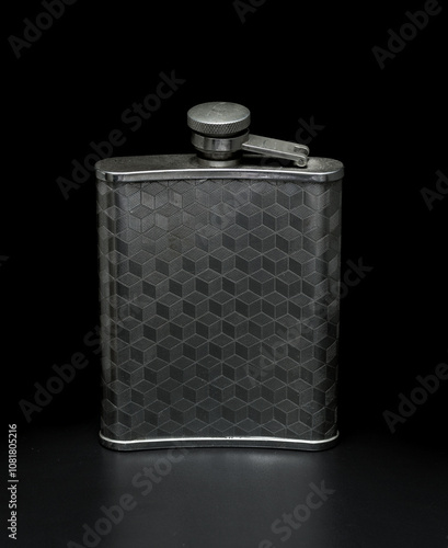 metal flask on a black background photo