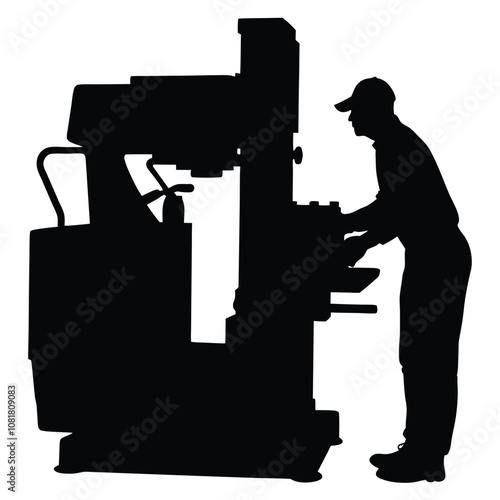 A man is working on a machine. The machine is black and has a large wheel. The man is wearing a hat