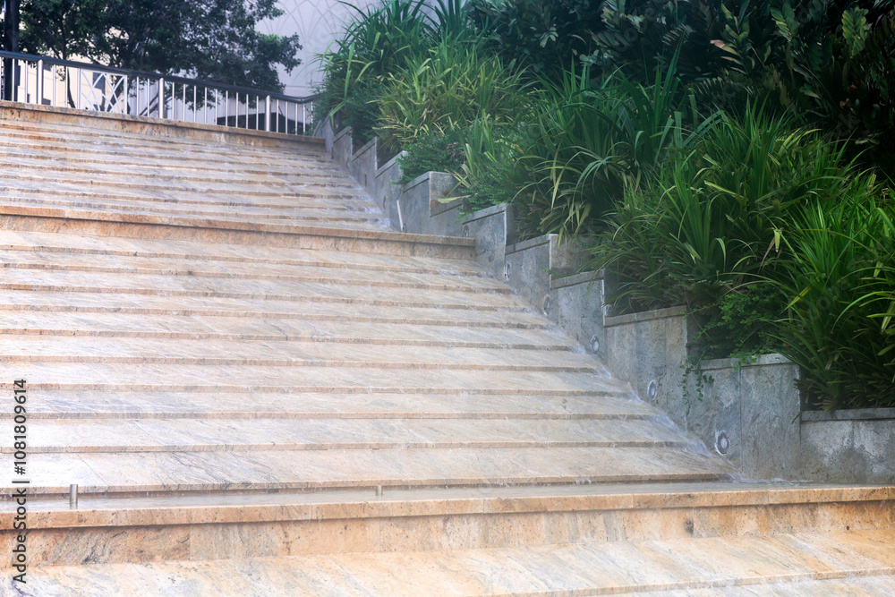 Obraz premium Urban object - water runs down stairs.