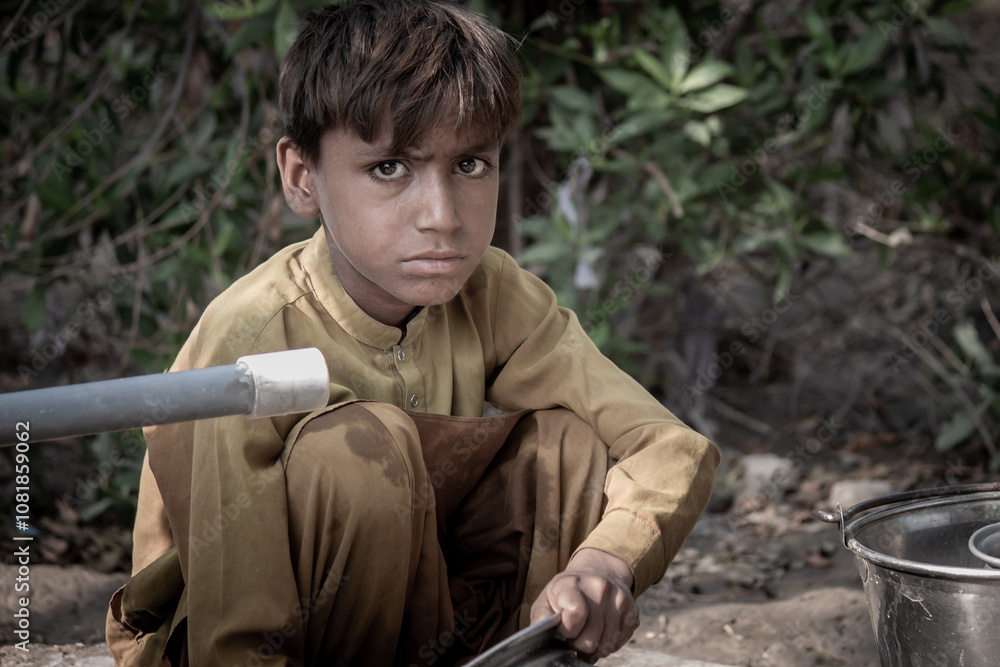 Fototapeta premium Pensive Portrait of an Indian Young Rural Boy
