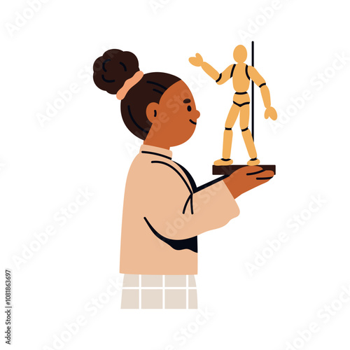Girl child holding wooden mannequin model for anatomy study and drawing lesso...