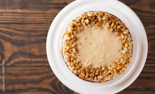 Pumpkin or carrot layered cake with coconut and caramel cream and walnut. Vegan cake, sugar, gluten and lactose free. Top view.