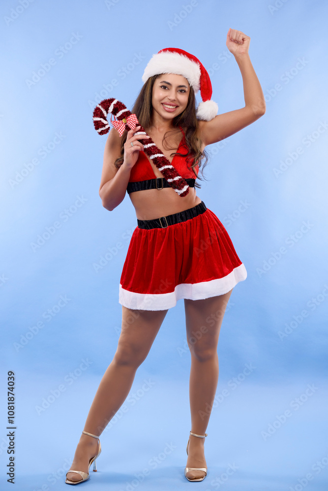 Obraz premium portrait of a beautiful woman dressed in a Christmas dress in a Christmas atmosphere making different gestures