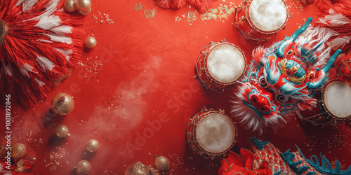 Top view of dragon dance props drums, masks on a red background photo