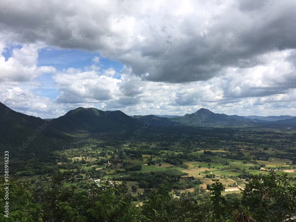 Fototapeta premium Mountainous Landscape with Cloudy Sky.