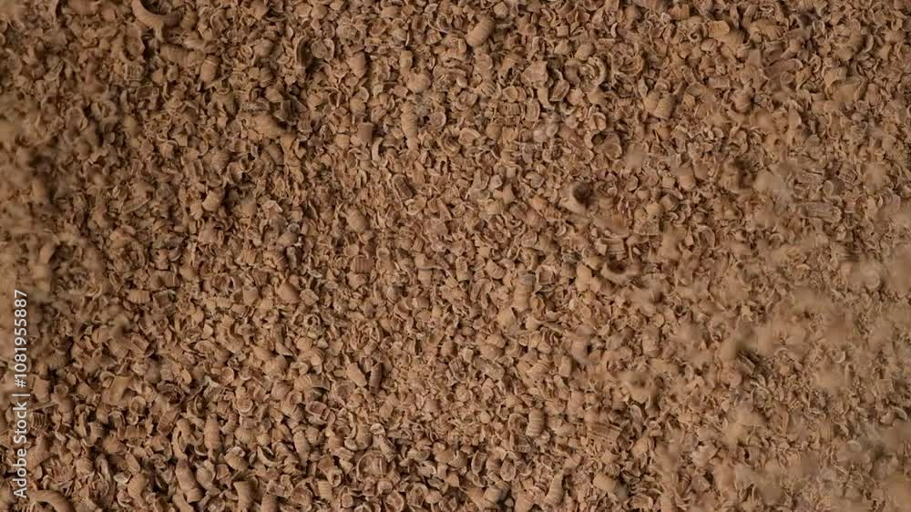 Sprinkle of chocolate shavings, top view, slow motion. Creative culinary background Sprinkle of chocolate shavings, top view, slow motion. Creative culinary background