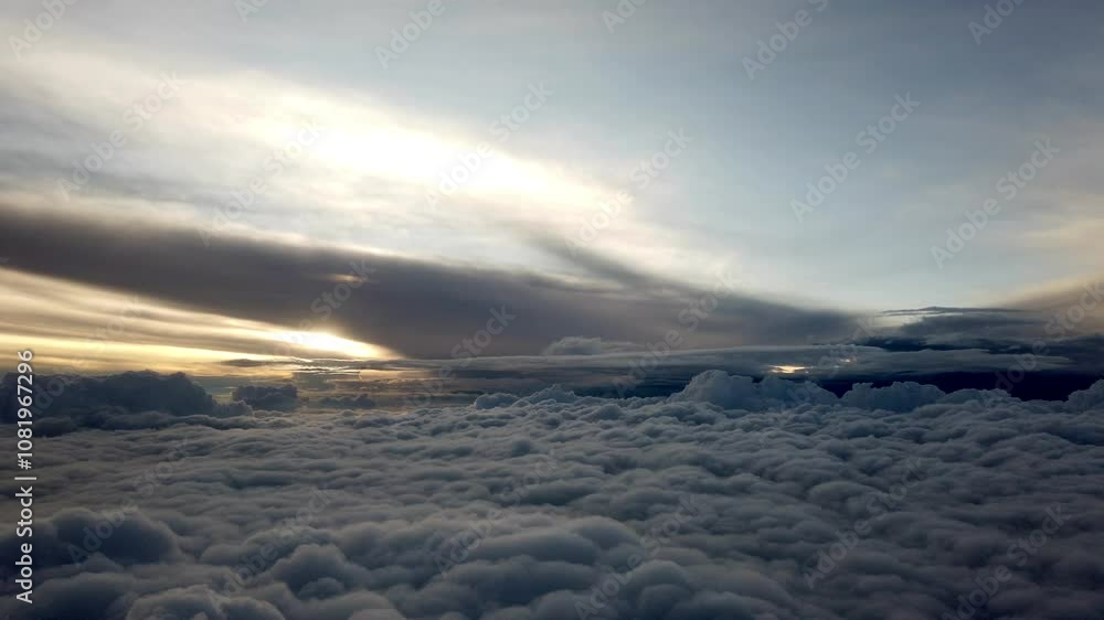 Sunlight shining through clouds creates a stunning view from an airplane window, showcasing the beauty of the sky Sunlight shining through clouds creates a stunning view from an airplane window, showcasing the beauty of the sky