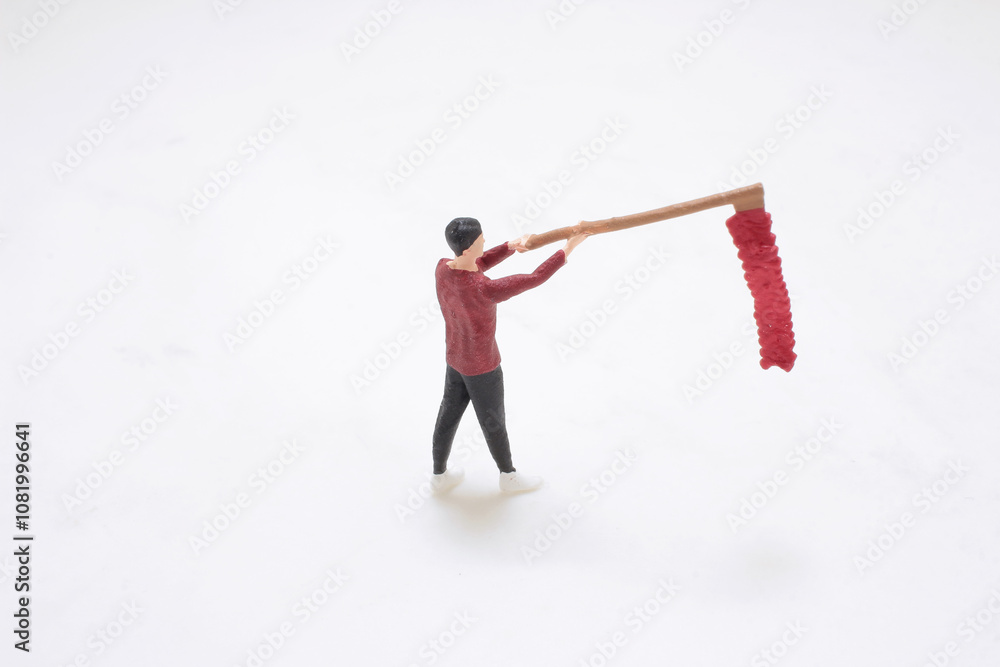 a Miniature Person Cleaning With Extended Duster a Miniature Person Cleaning With Extended Duster