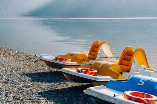 water catamarans on the beach of the resort town near the sea for tourists. Resort water transport. Boats for tourists.