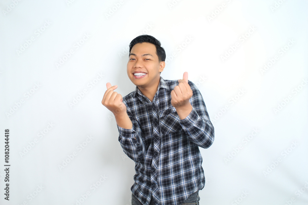attractive asian man give finger love symbol with smiling face isolated on white background attractive asian man give finger love symbol with smiling face isolated on white background