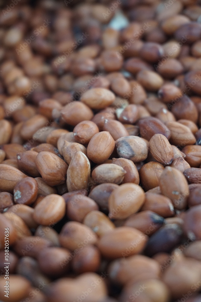 A heap of roasted peeled peanut on a street foodcart, Fresh roasted peanuts selling by a street vendor, A bunch of peeled peanuts. A heap of roasted peeled peanut on a street foodcart, Fresh roasted peanuts selling by a street vendor, A bunch of peeled peanuts.