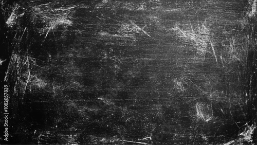 Black grunge scratched background with old film effect and dusty scary texture; space for text or design. Dark and scratched black grunge background, scratched black texture vintage film style.