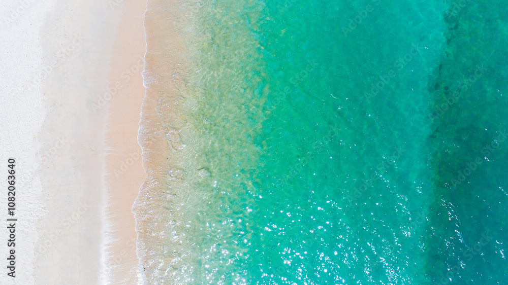 A background or texture of turquoise sea and waves at a beach. summer background and summer holiday concept. A background or texture of turquoise sea and waves at a beach. summer background and summer holiday concept.