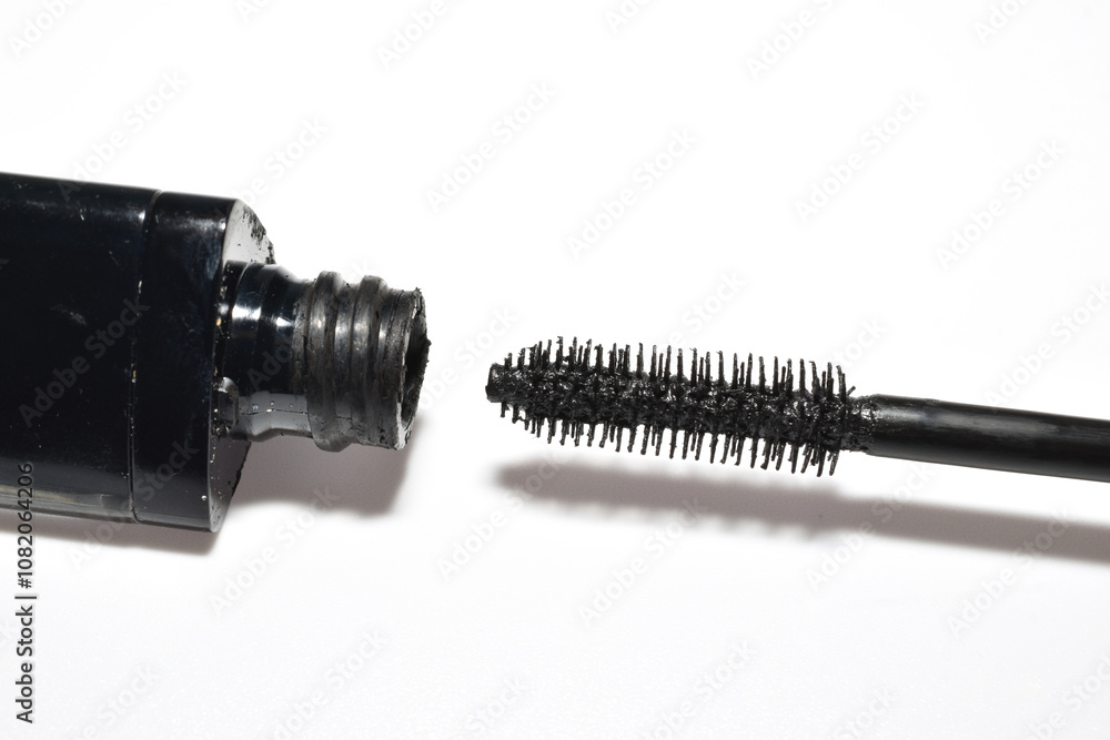 Mascara with a brush lies on a white background. Mascara with a brush lies on a white background.