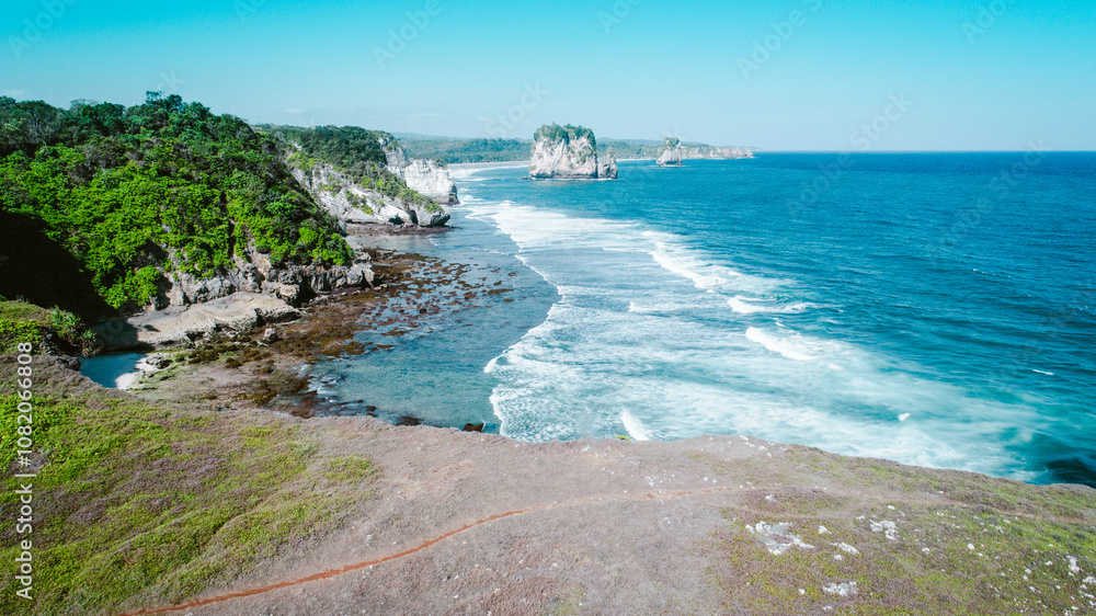 Aerial view of sea crashing waves white foaming waves on seashore rocks and rocky coast Aerial view of sea crashing waves white foaming waves on seashore rocks and rocky coast