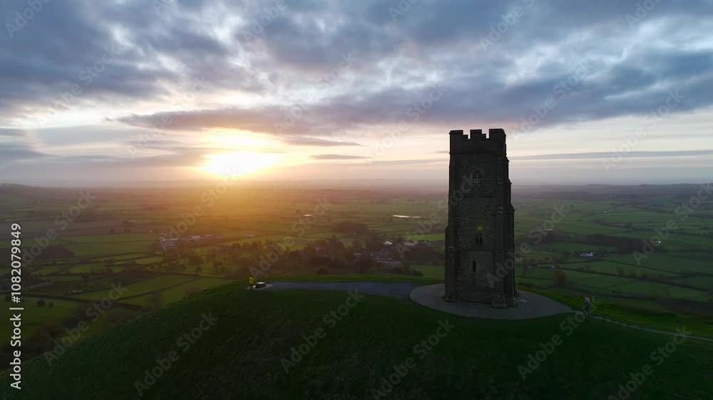 Sunrise over Glastonbury Tor from a drone at autumn, Glastonbury, Somerset, England Sunrise over Glastonbury Tor from a drone at autumn, Glastonbury, Somerset, England
