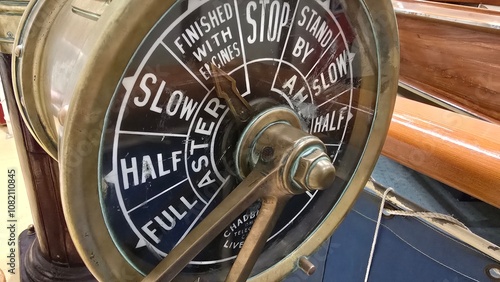 A ship's engine order telegraph (EOT), also known as a Chadburn. This device was used on ships to communicate engine speed commands from the bridge to the engine room. photo