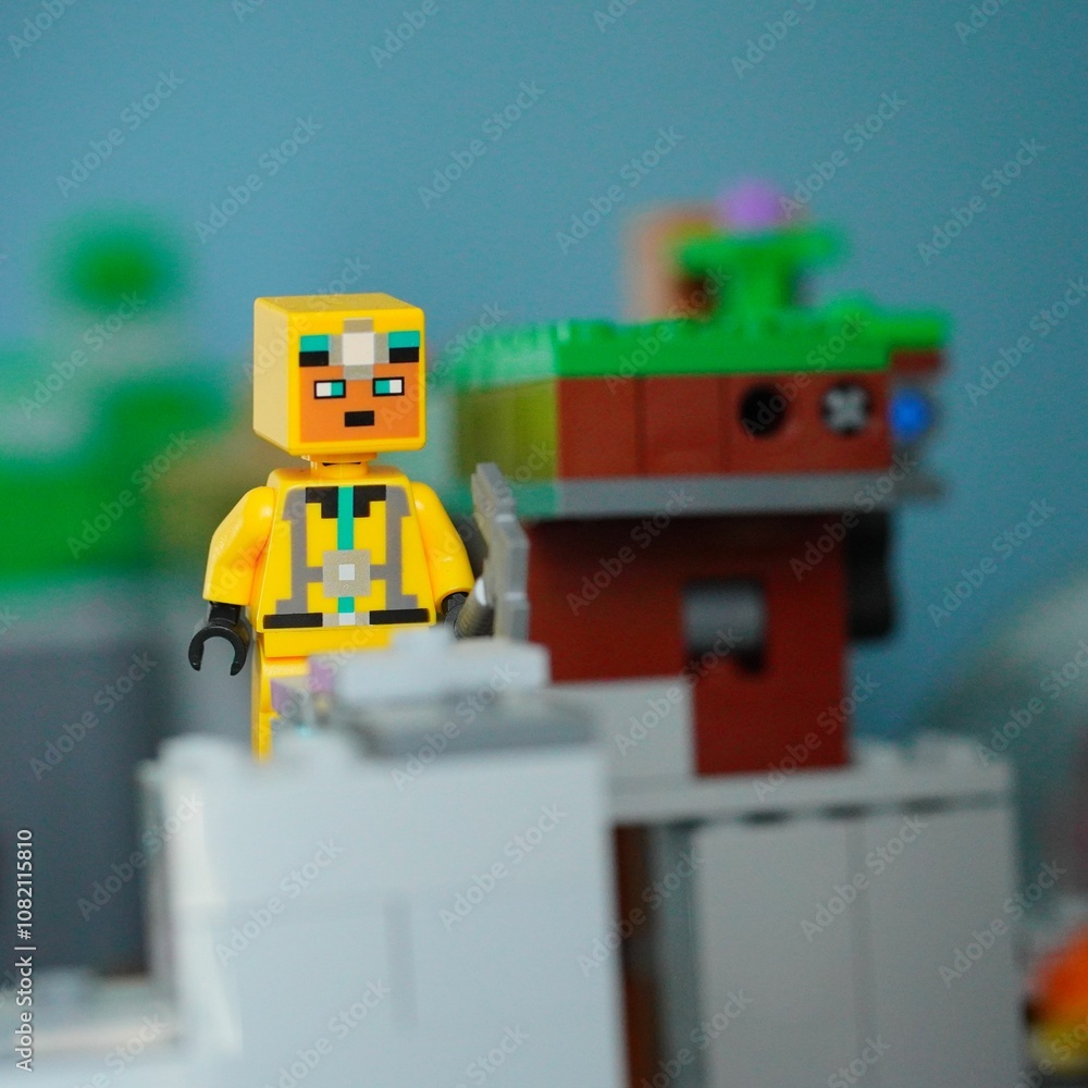 Fototapeta premium Closeup shot of a Lego Minecraft figurine against a blurry background.
