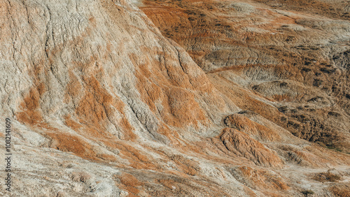 landscape of candy look mountains with colorful minerals desert appearance and blue sky  photo