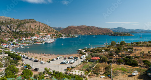 Fototapeta Naklejka Na Ścianę i Meble -  Top view of Bozburun bay. Green island and gulet boats. Cosy holiday village in mediterranean Turkey. Marmaris district, Mugla province, Turkey 