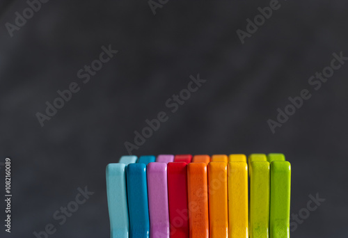 wooden blocks rainbow colored gray background