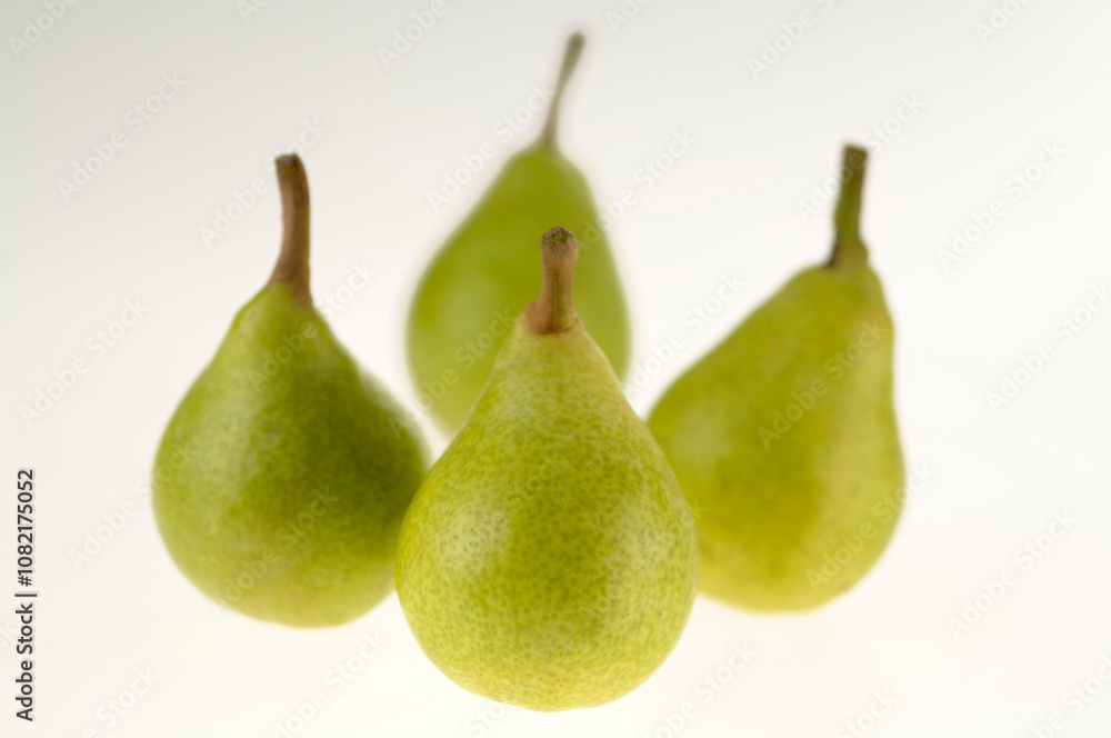 four Pear Pyrus Commiunis on white background four Pear Pyrus Commiunis on white background