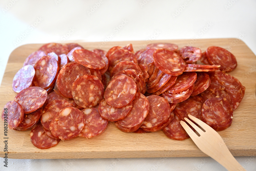Cutting board Italian salami on white background Cutting board Italian salami on white background