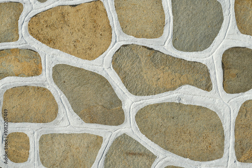 Fototapeta Naklejka Na Ścianę i Meble -  The surface of the stone floor with white seams Traditional cobblestone white painted pattern pavement
