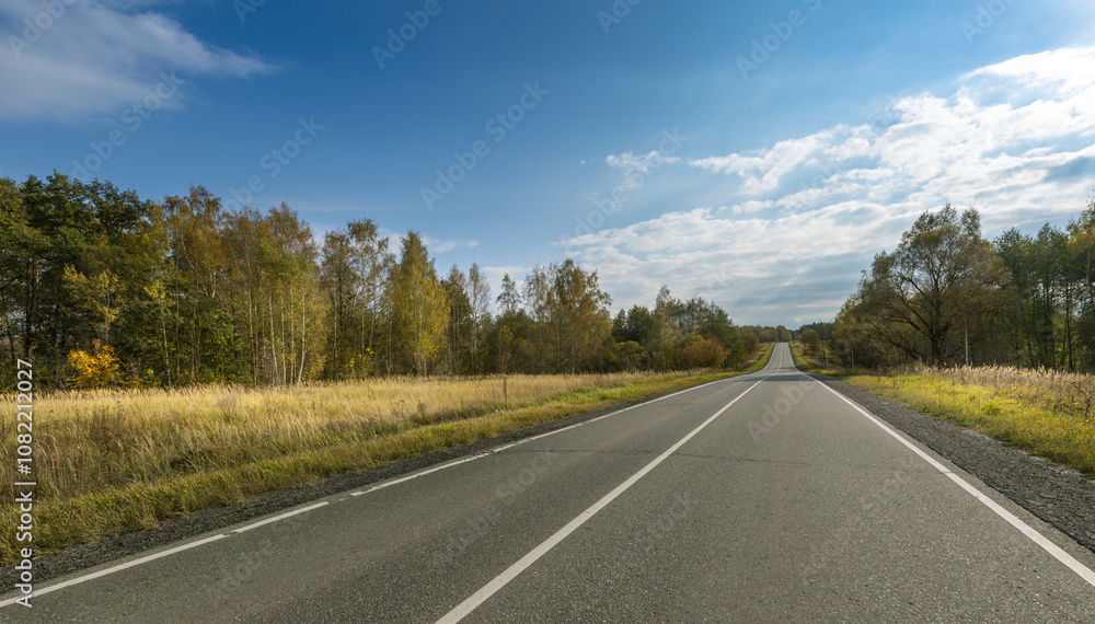 Fototapeta premium A road with a clear blue sky above it