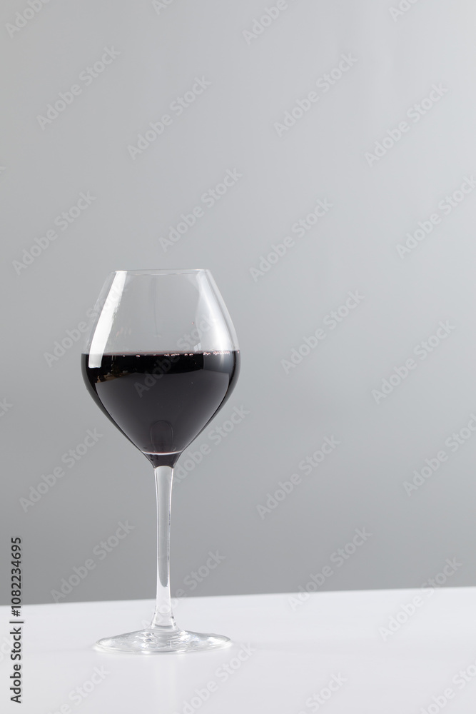 Glass of red wine and copy space on white background Glass of red wine and copy space on white background