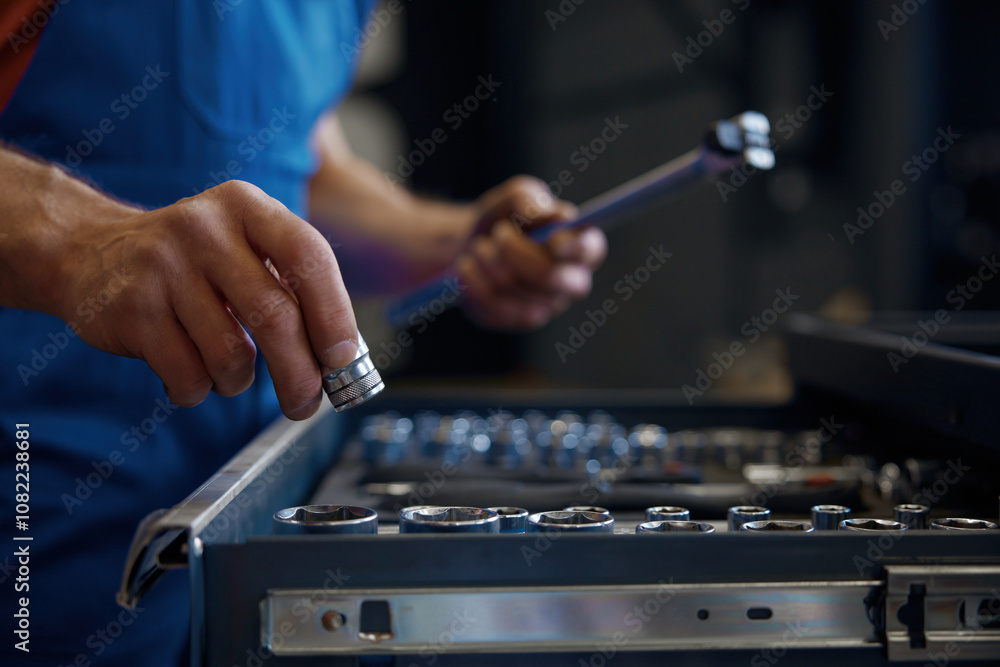 Tool box and male mechanic hands taking wrench for work Tool box and male mechanic hands taking wrench for work