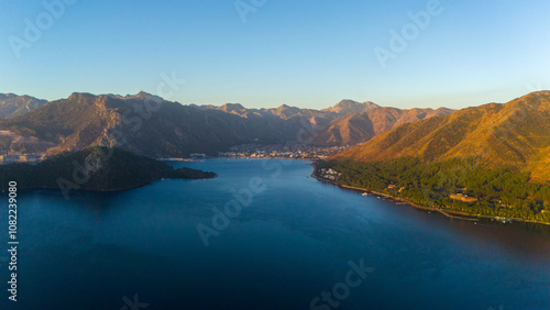 Fototapeta Naklejka Na Ścianę i Meble -  Drone aerial view of Marmaris and the mountains around during sunrise