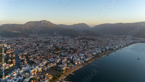 Fototapeta Naklejka Na Ścianę i Meble -  Drone aerial view of Marmaris and the mountains around during sunrise