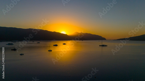 Fototapeta Naklejka Na Ścianę i Meble -  Drone aerial view of Marmaris and the mountains around during sunrise