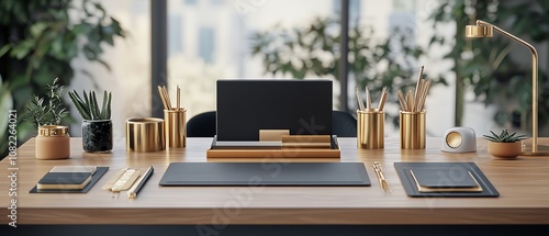 Elegant office desk setup with gold accessories and plants.