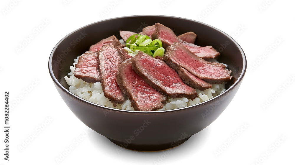 A delicious bowl of rice topped with slices of tender, seared beef and garnished with green onions. A delicious bowl of rice topped with slices of tender, seared beef and garnished with green onions.