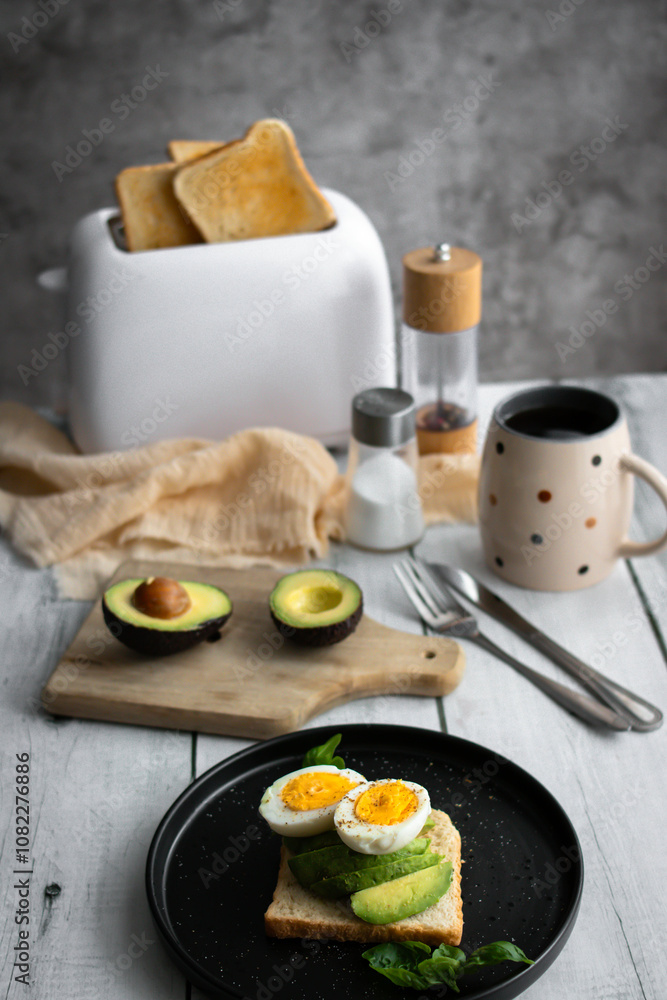 Sandwiches with avocado, tomatoes and poached eggs. on a wooden backyard. Snidanok.
Sandwiches with avocado, tomatoes and poached eggs. on a wooden backyard. Snidanok.