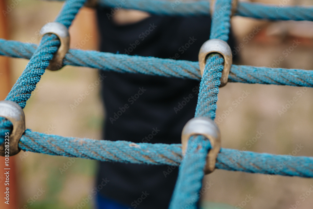 rope hemp net connected in a wooden frame by means of metal stainless steel connectors. it is an attraction for children on the playground rope hemp net connected in a wooden frame by means of metal stainless steel connectors. it is an attraction for children on the playground